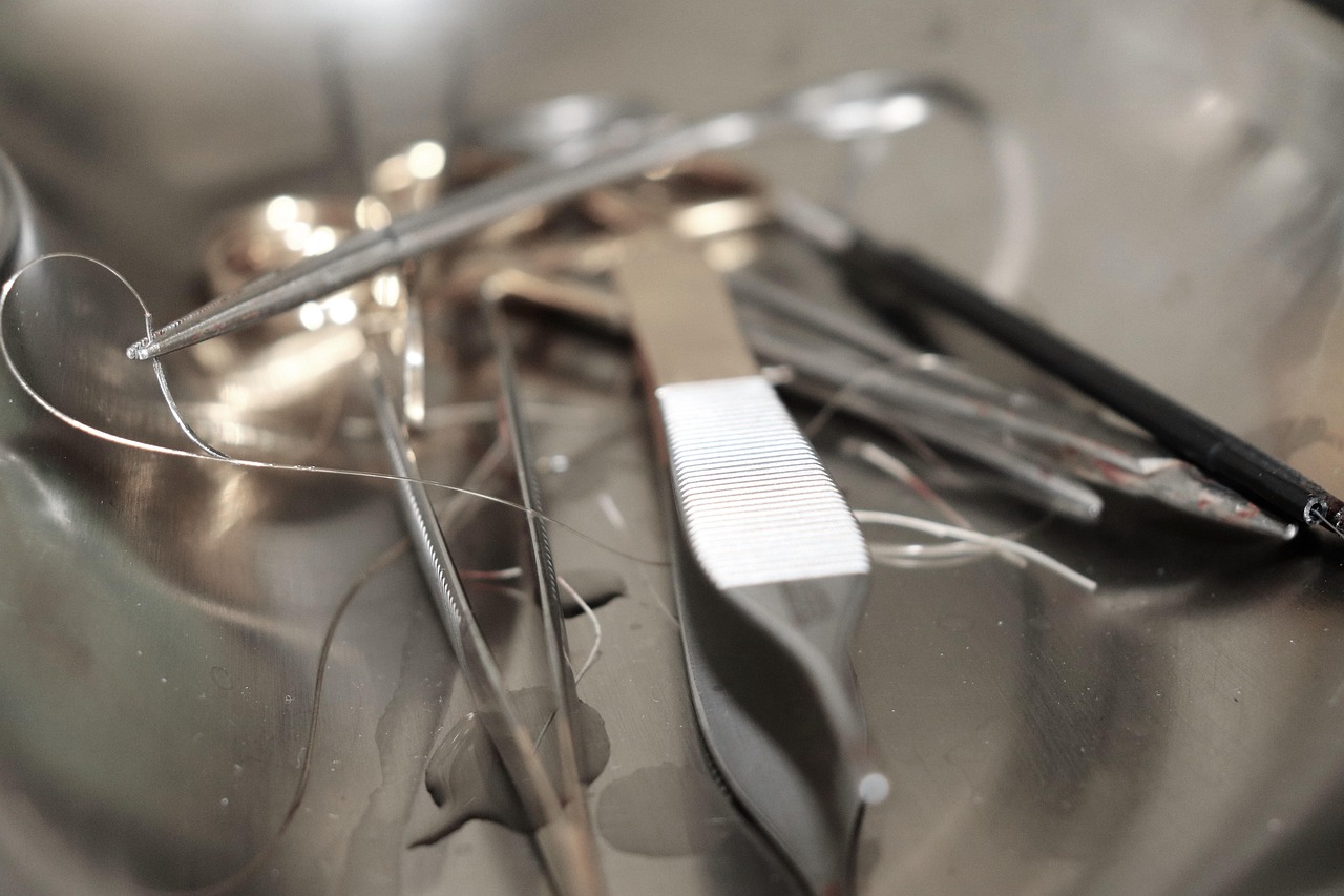 surgical tools, surgery, instruments, medical, operation, stainless steel, scalpel, tweezers, suture, hospital, healthcare, close-up, sterile, procedure, doctor, clinic, surgeon, wound care, needle, thread, disinfection, tray, emergency, precision tools, medical practice